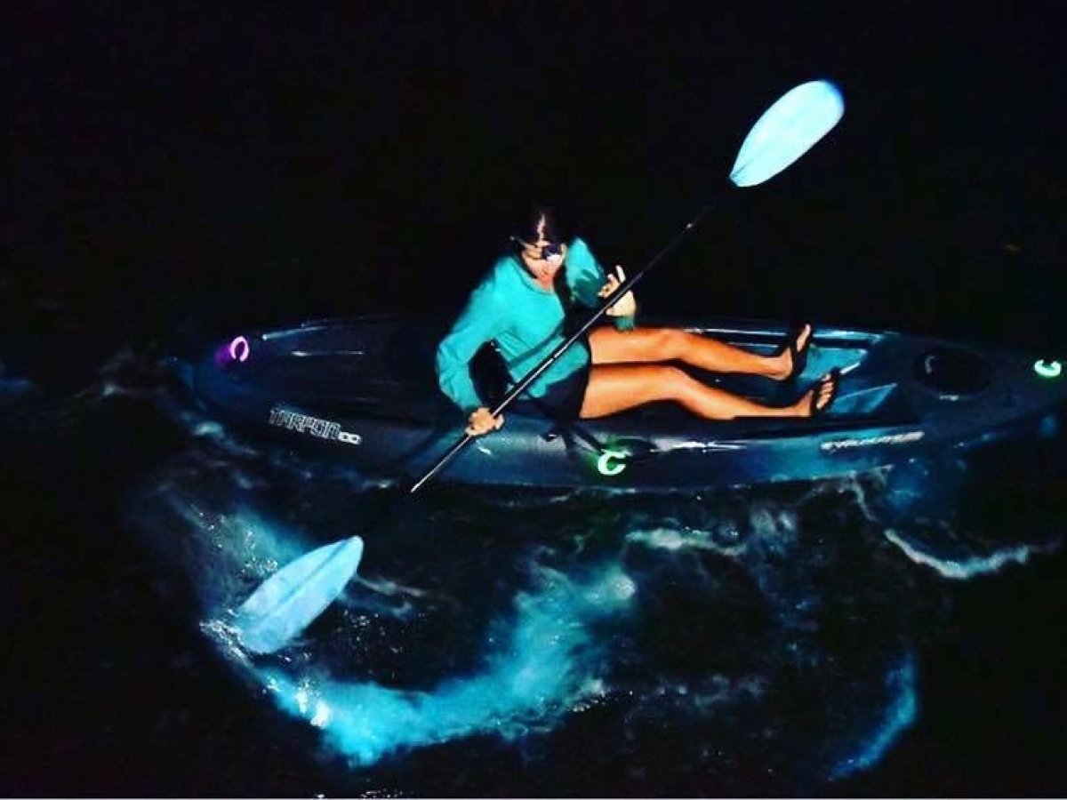 a person sitting in a dark room