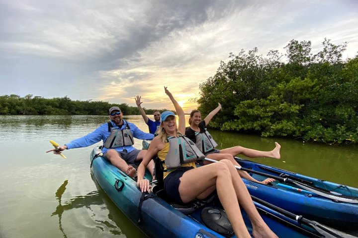 a person sitting on a raft in a body of water