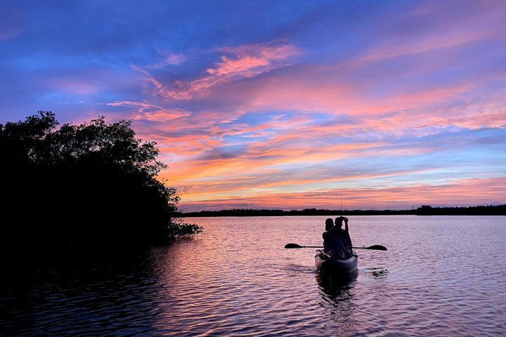 a man in a boat on a body of water