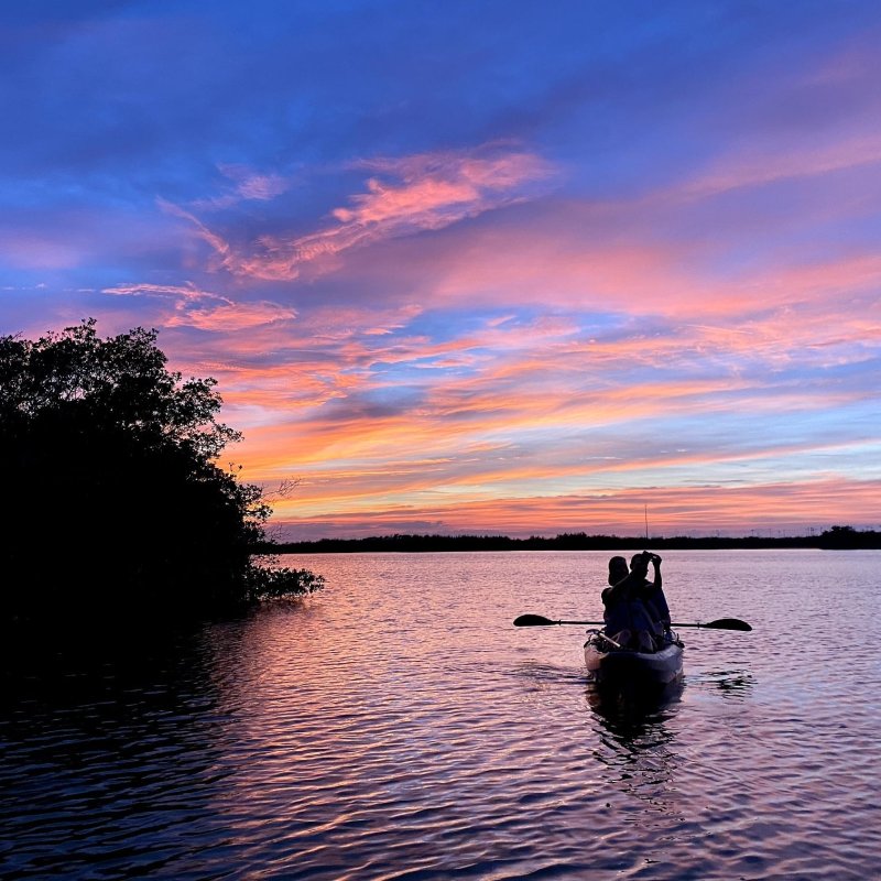 a man in a boat on a body of water