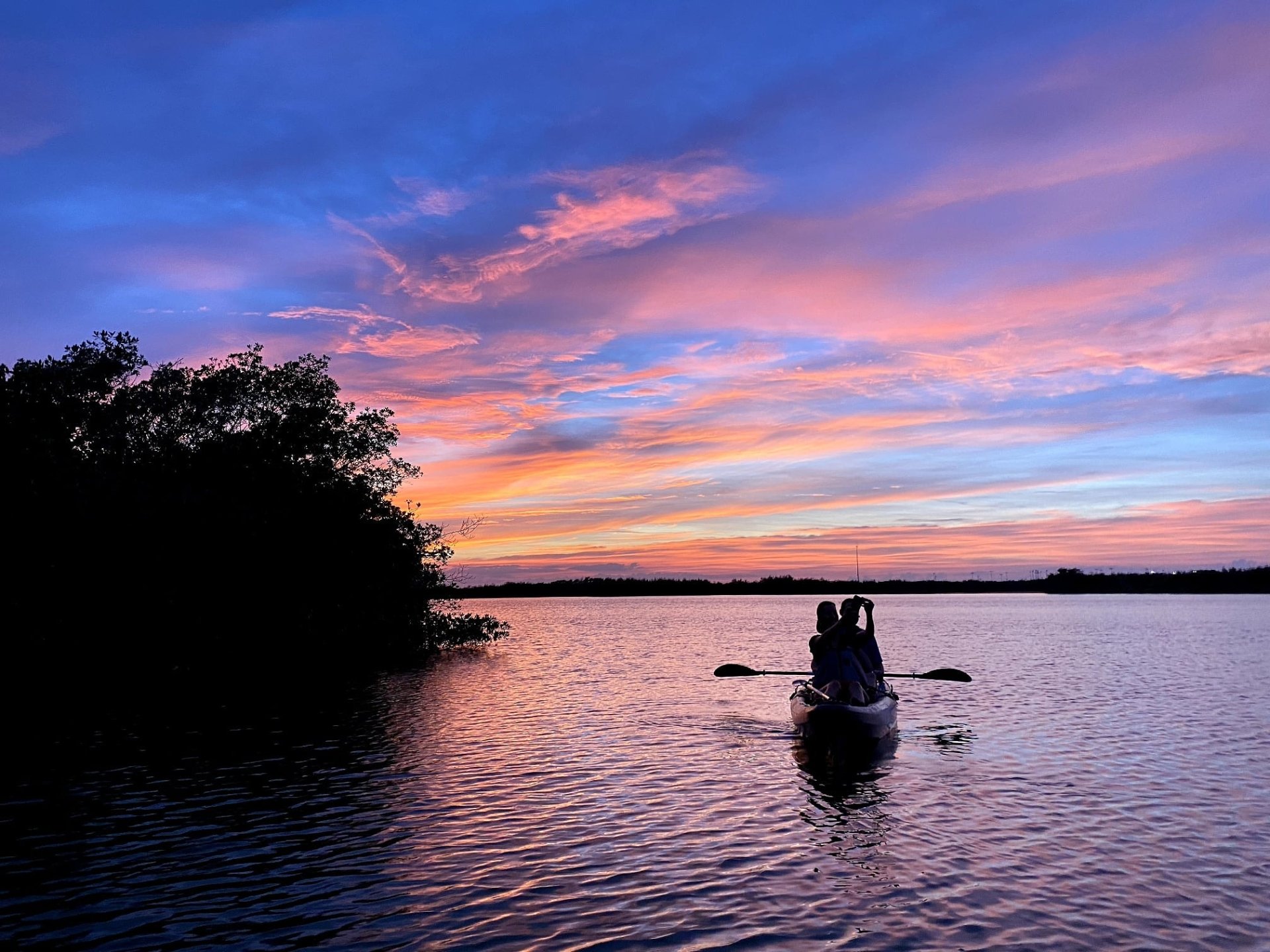 a man in a boat on a body of water