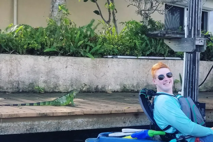 a person sitting in front of a building