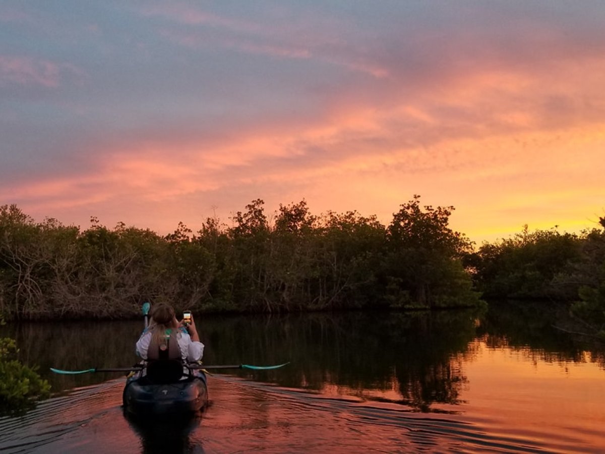 a sunset over a body of water