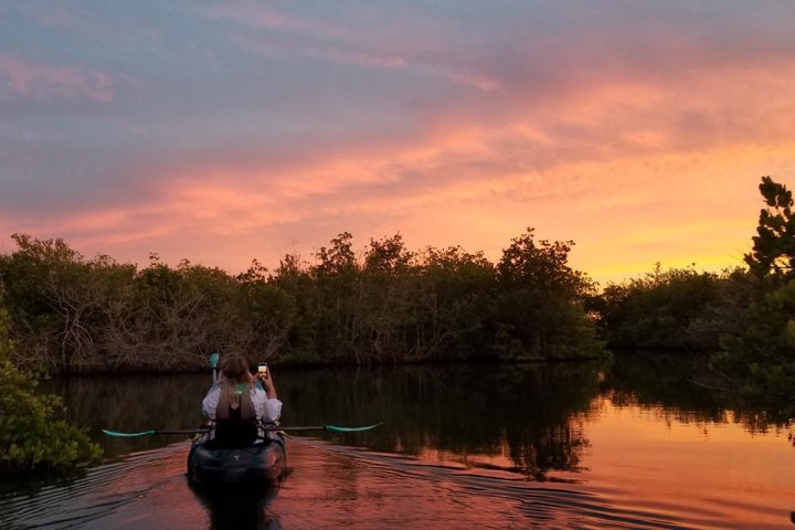 a sunset over a body of water