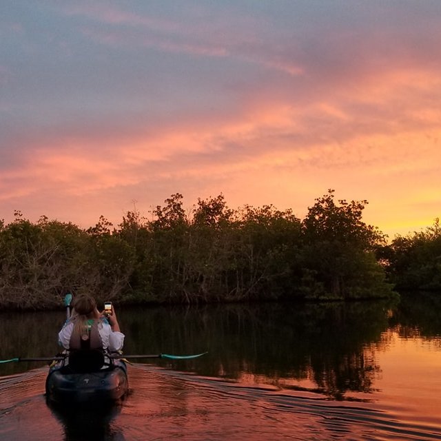 a sunset over a body of water