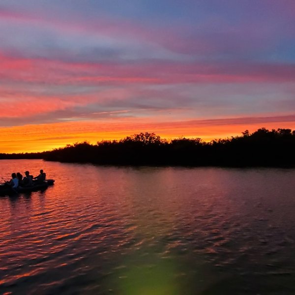 a small boat in a large body of water
