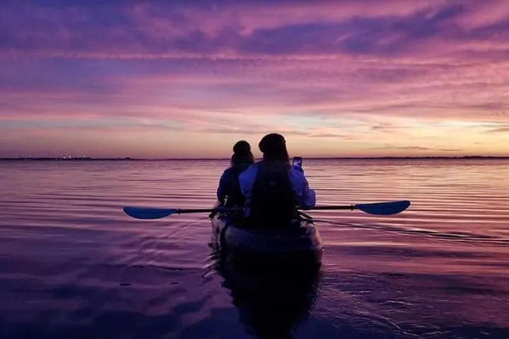 a sunset over a body of water