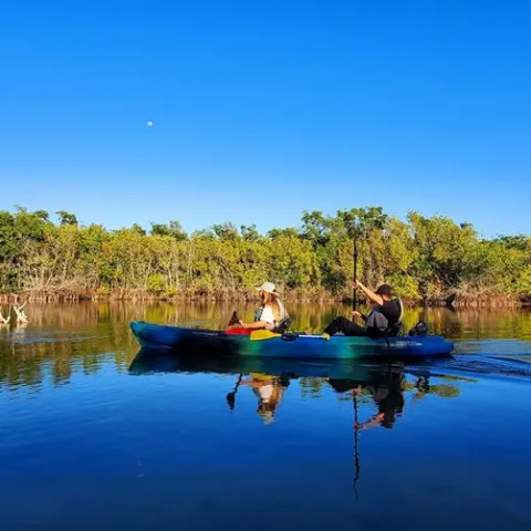 a small boat in a body of water