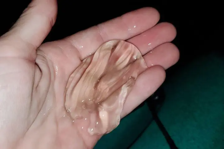 a hand holding a piece of paper