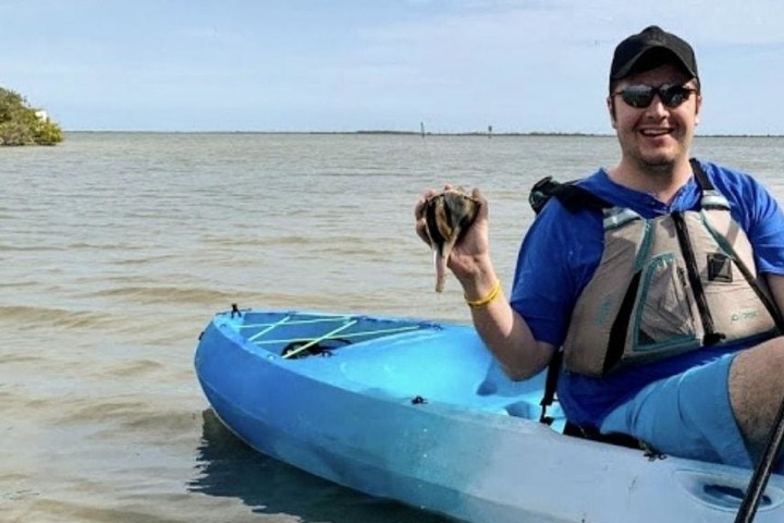 a person in a boat on a body of water