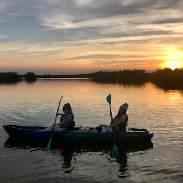 a man in a boat on a body of water