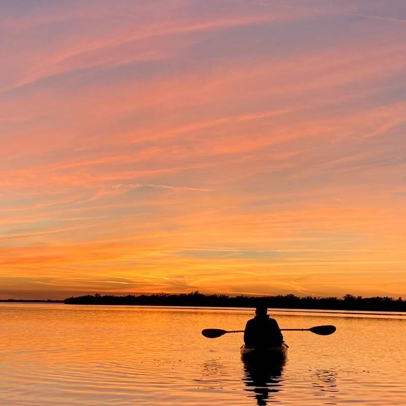 a sunset over a body of water