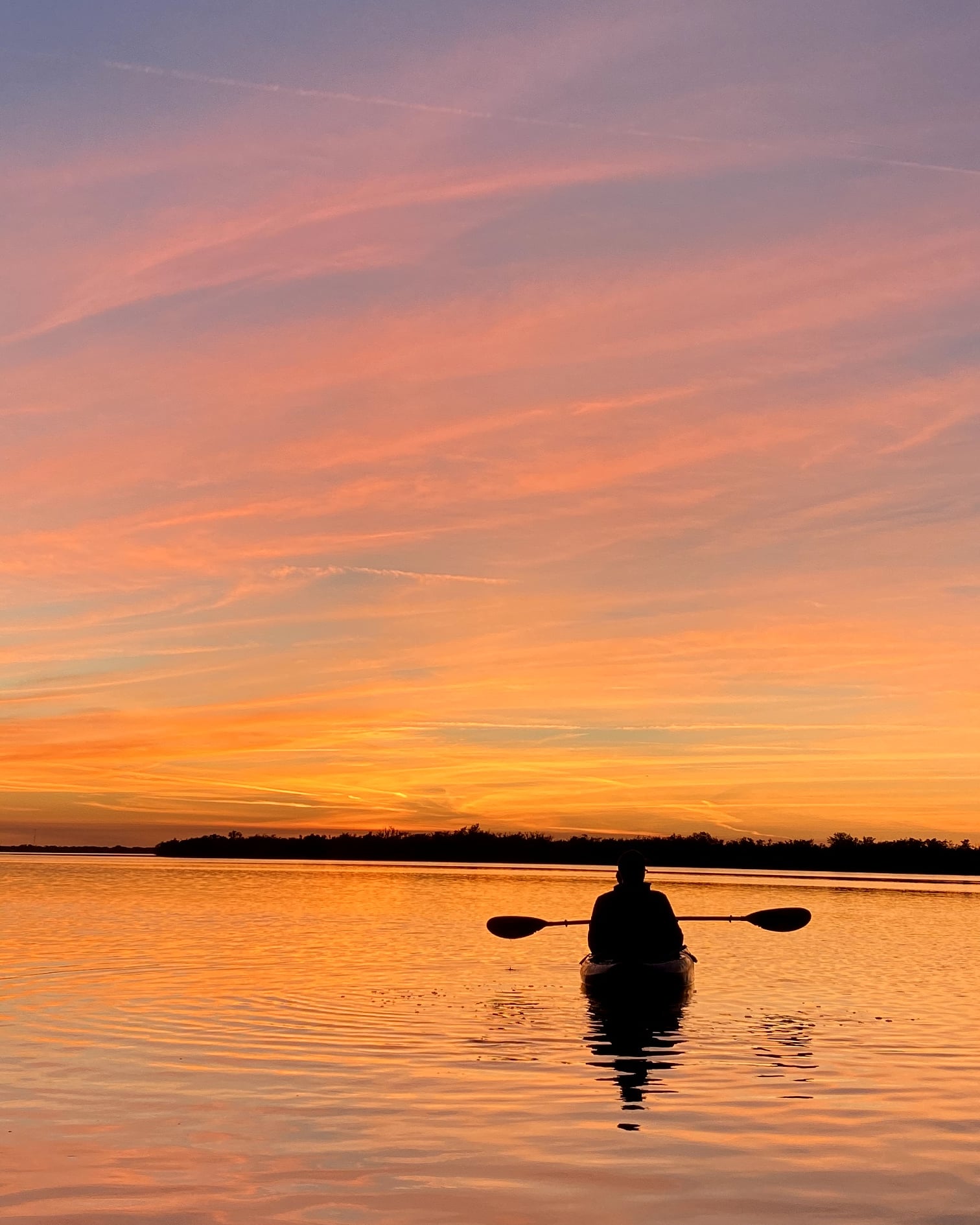 a sunset over a body of water