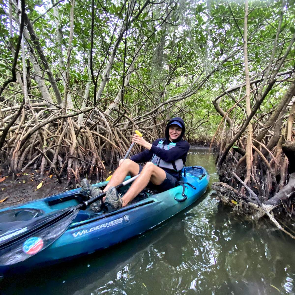 a person riding on the back of a boat