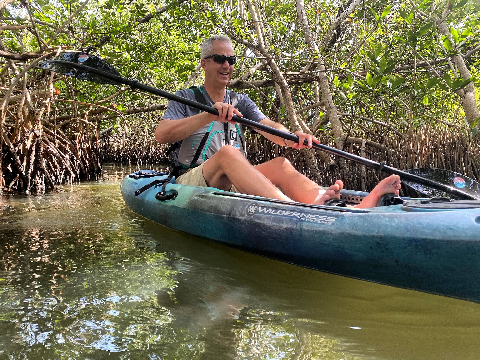 a man riding on the back of a boat