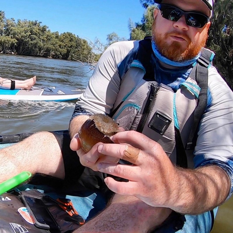 a man holding a glass of water