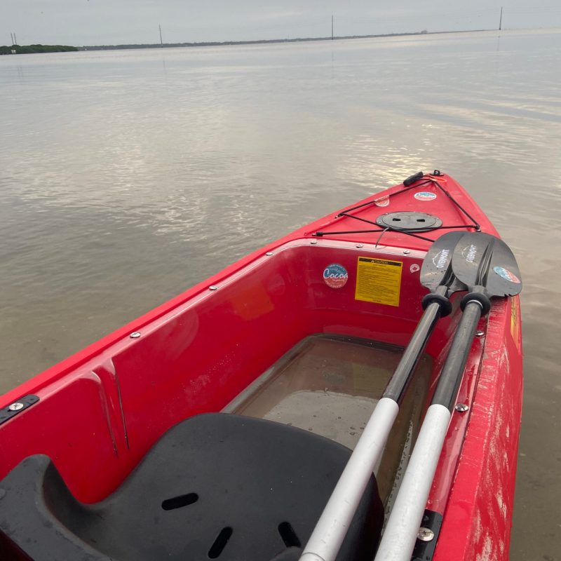 a boat sitting next to a body of water