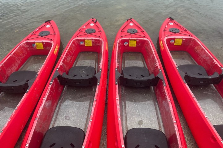 a boat sitting in the sand