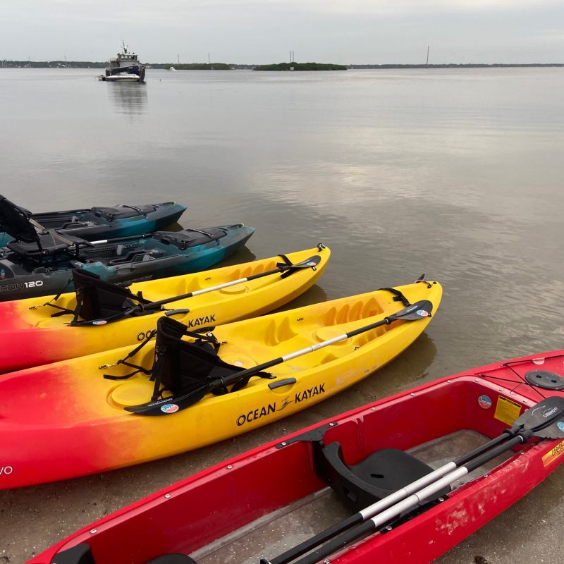 a boat sitting next to a body of water