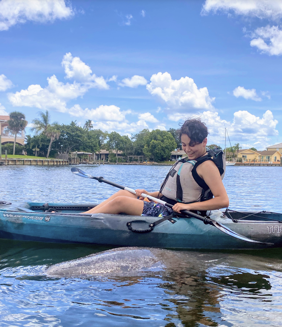 CDB26B53-C4E0-4433-AA79-A58EEFCE592E a person rowing a boat in the water
