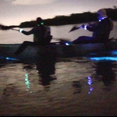 a person sitting in a dark room