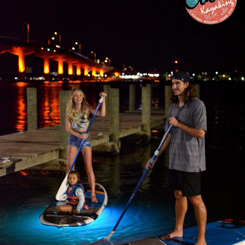 a couple of people that are standing in the water