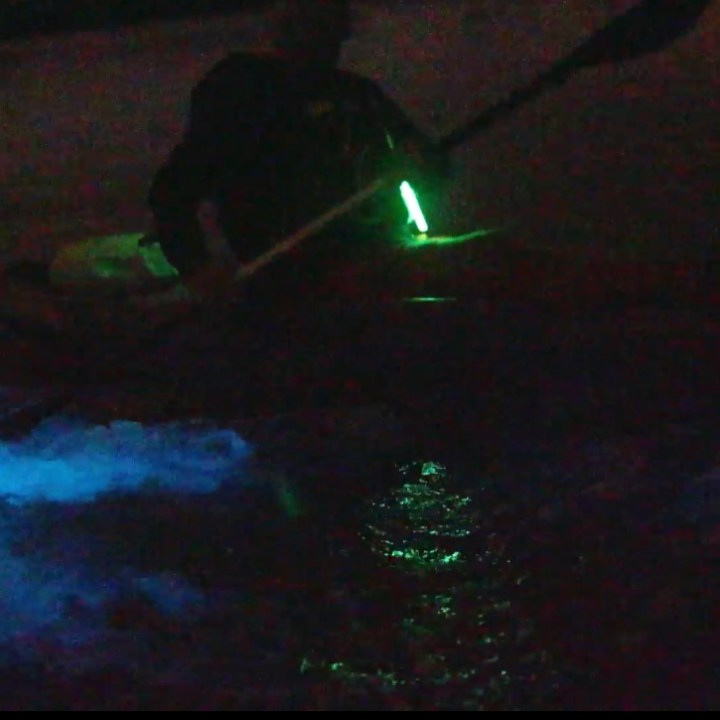 a person sitting in a dark room