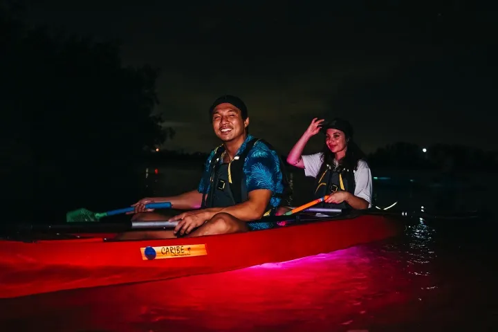 a man sitting on a boat in the water