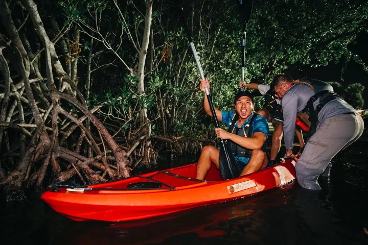 a man riding on the back of a boat