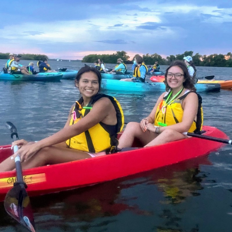 Jamie Hampton sitting on a boat in the water