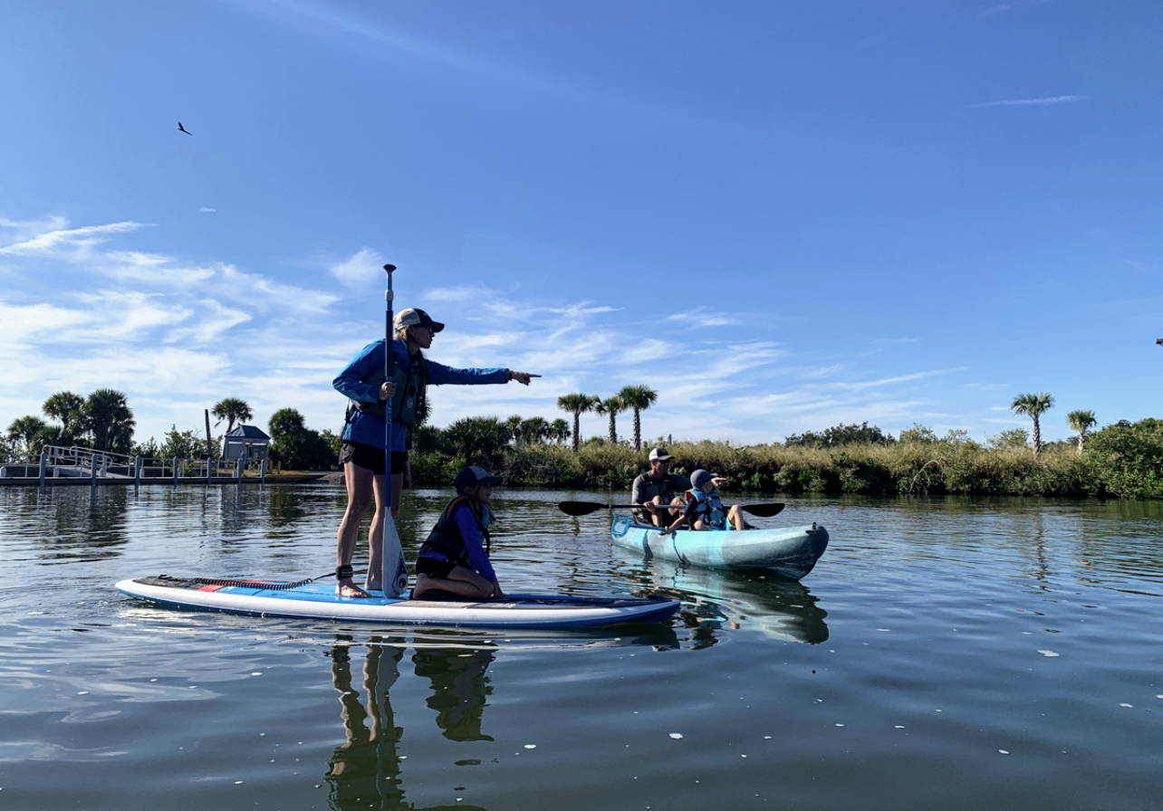 27230C27-4529-4858-81CF-C0322217BC78 a man riding on the back of a boat in the water