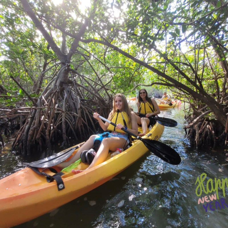 a person riding on the back of a boat in the water