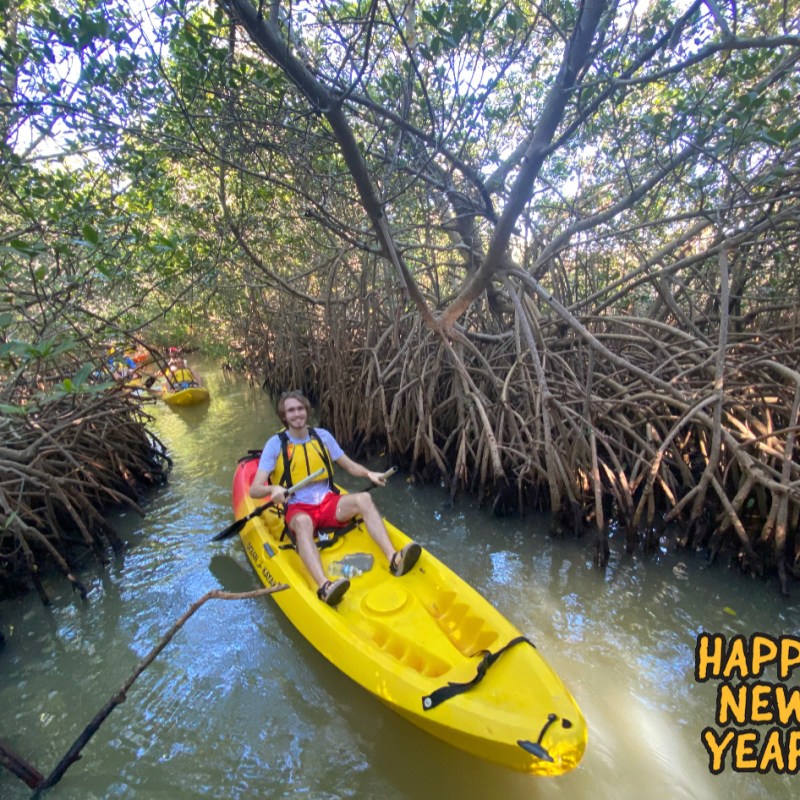 a group of people on a raft in a body of water
