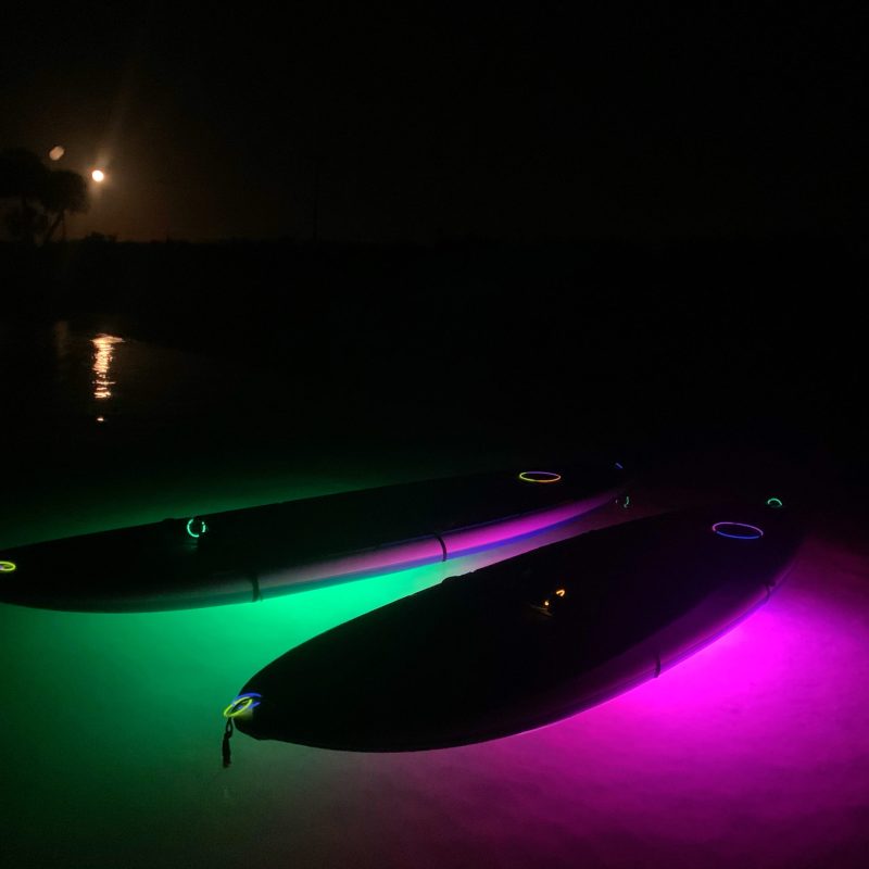 a purple light in a dark room