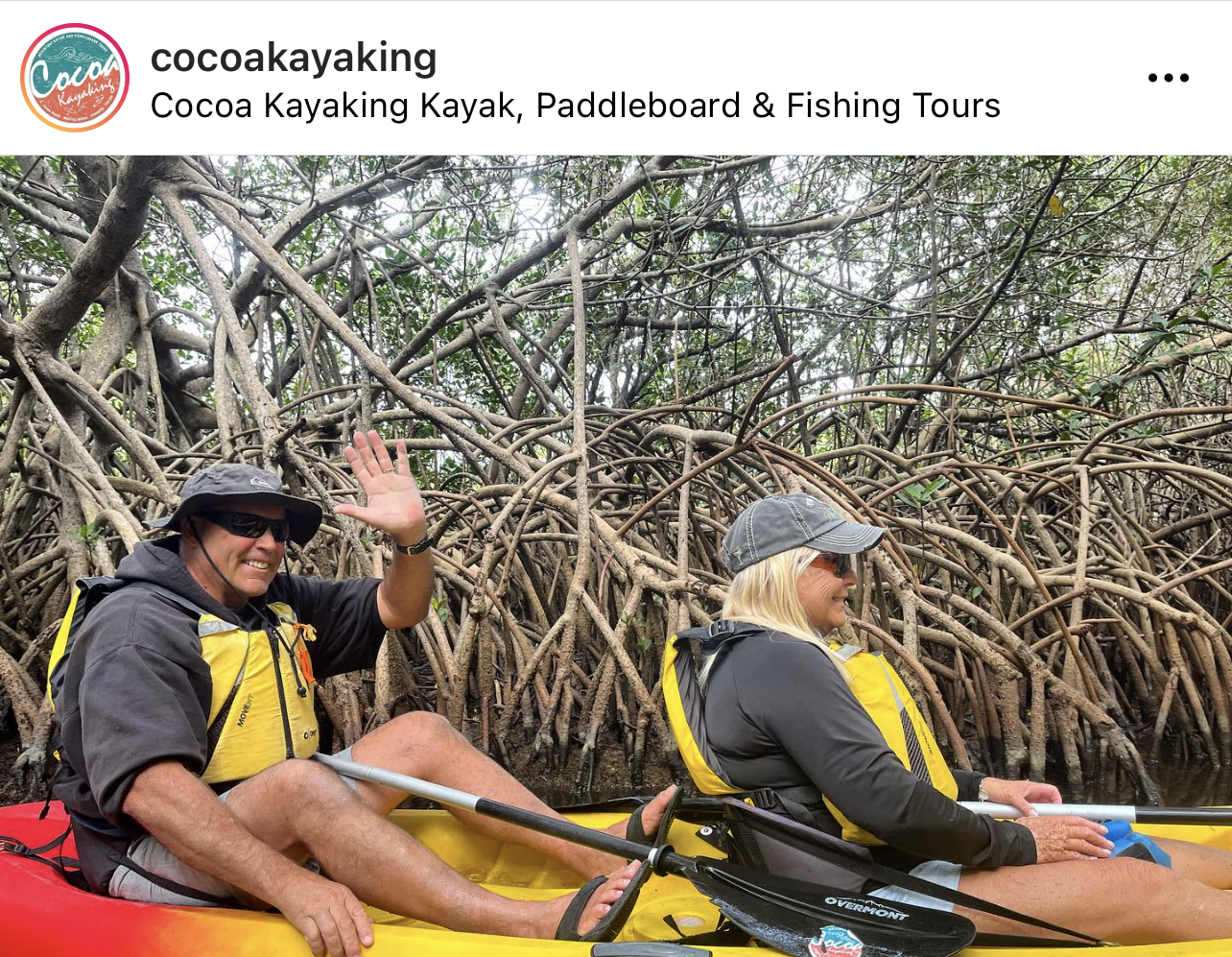 a group of people sitting on a raft