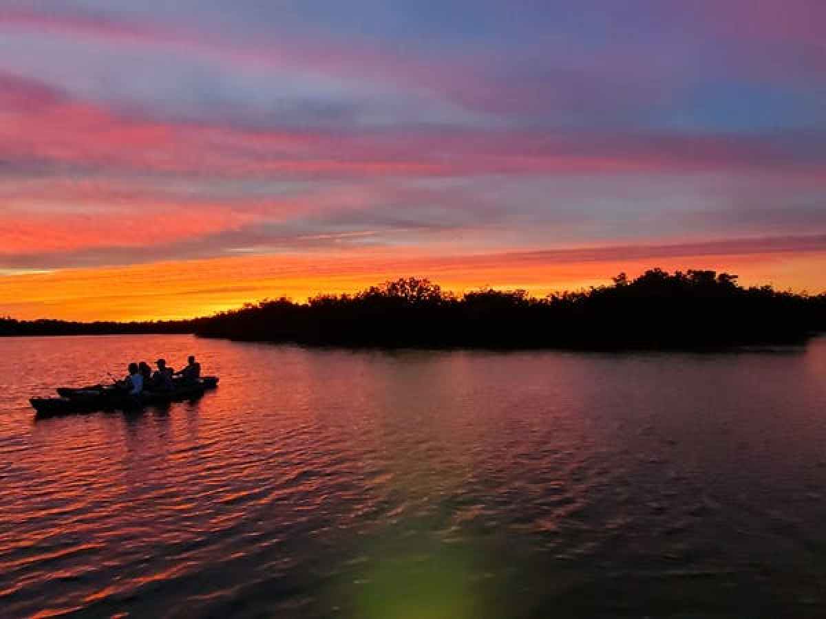 a small boat in a large body of water