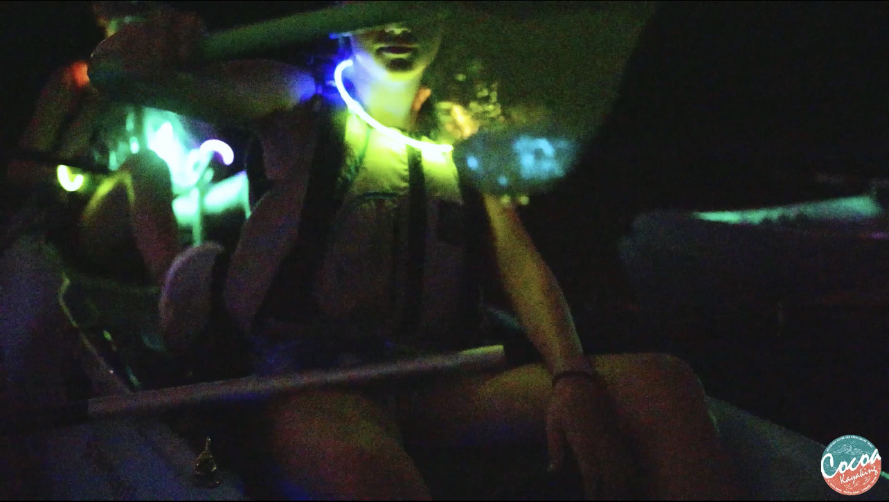 a person sitting in a dark room