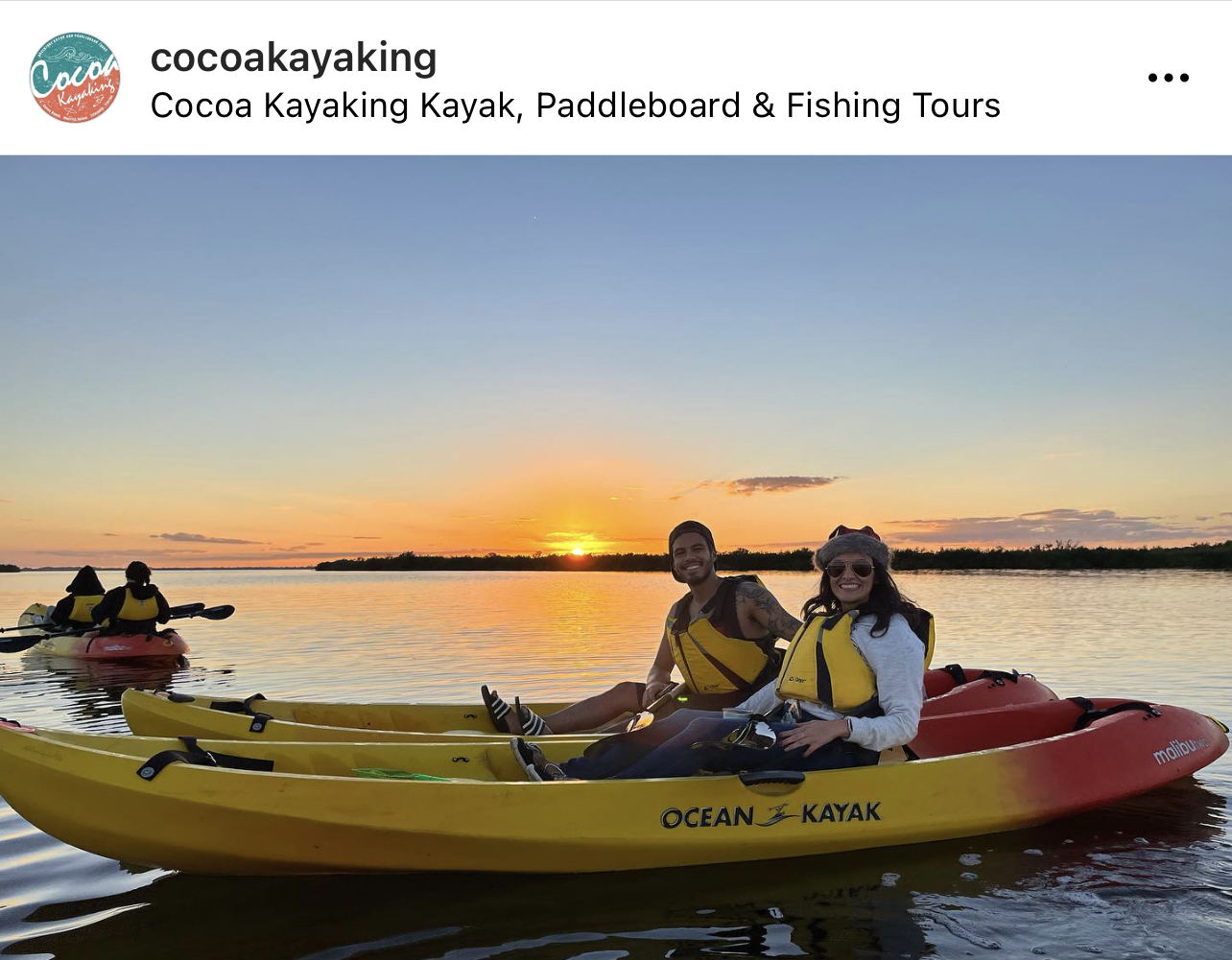 a group of people on a boat in the water