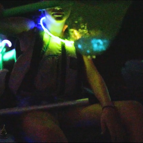 a person sitting in a dark room