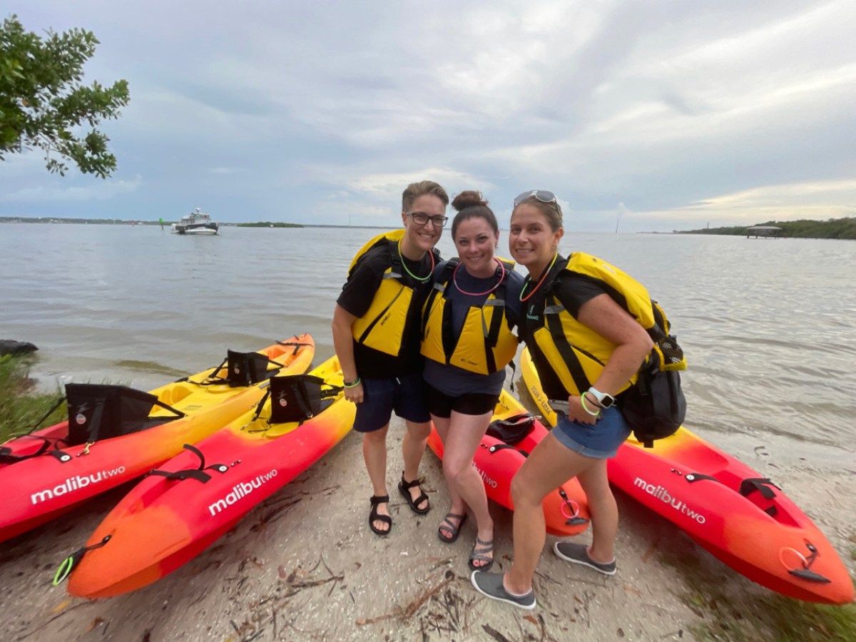 a person sitting on a boat in a body of water