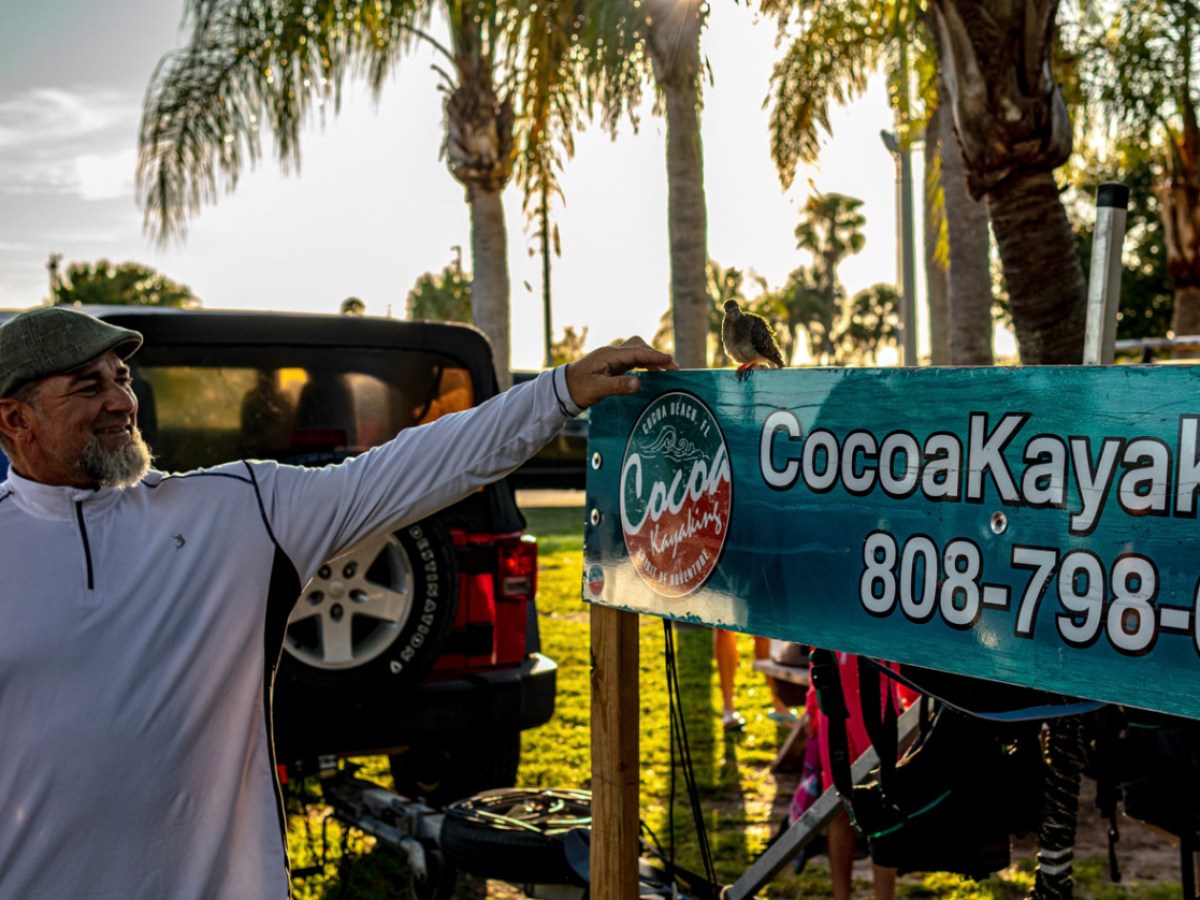 a man holding a sign
