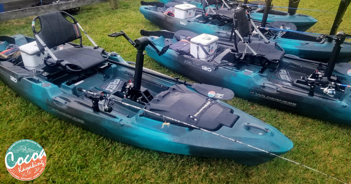06D2E98F-9F53-4128-9092-8BAC85B56604 a group of lawn chairs sitting on top of a grass covered field