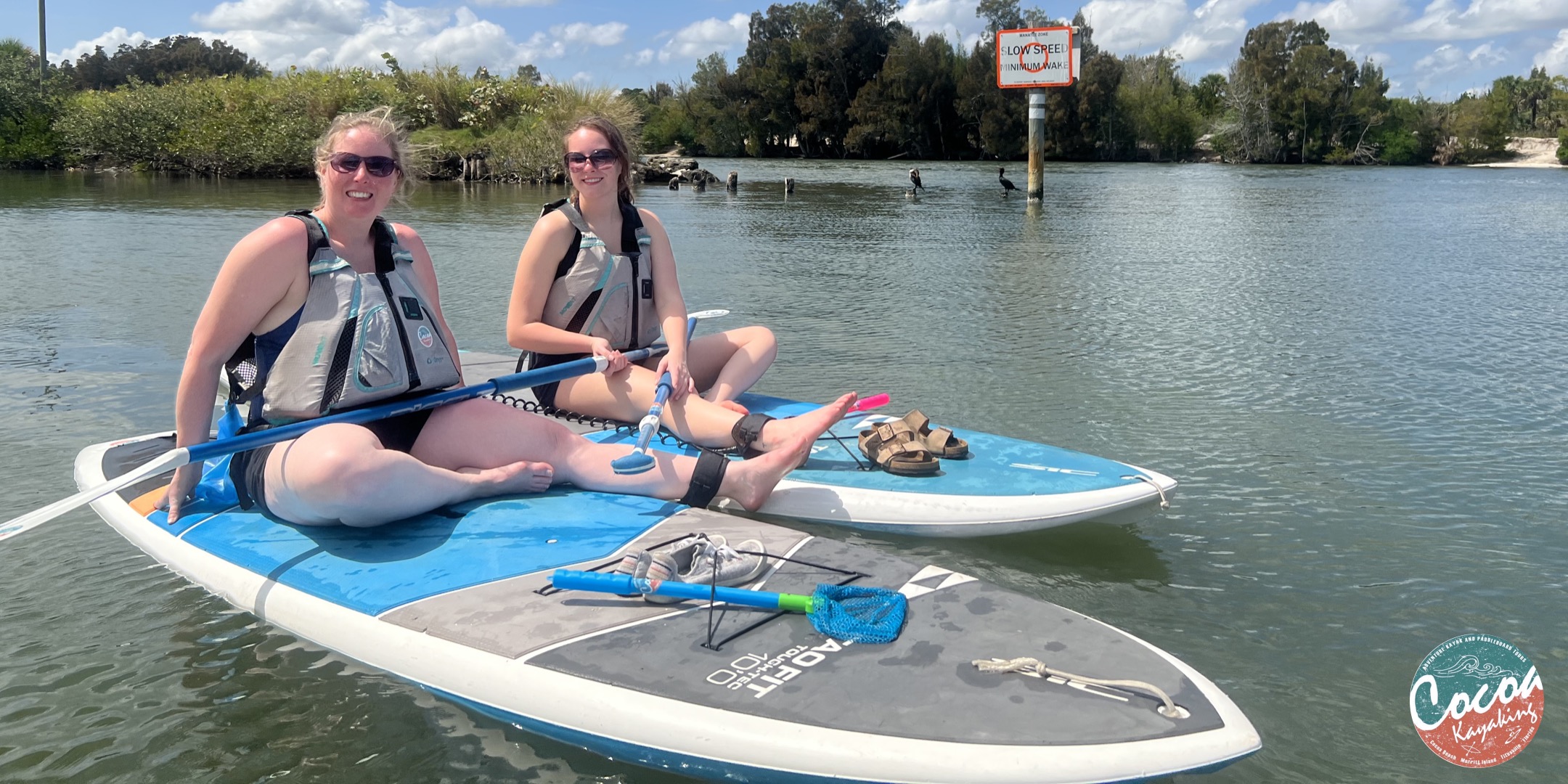 a woman sitting on a boat in the water