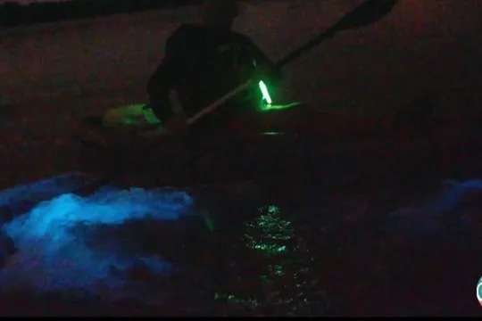 a person sitting in a dark room