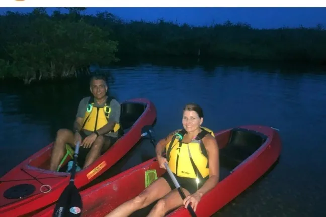 a man rowing a boat in a body of water