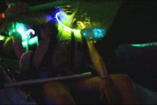 a person sitting in a dark room