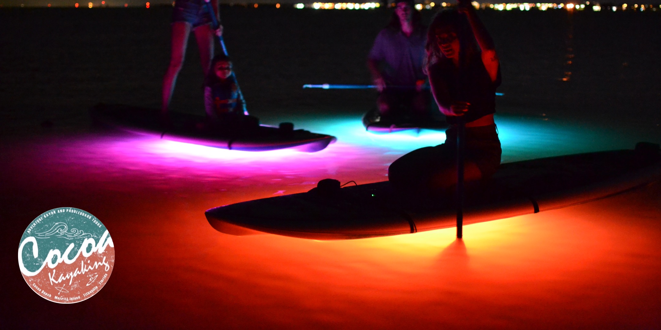 a person sitting at a table in a dark room