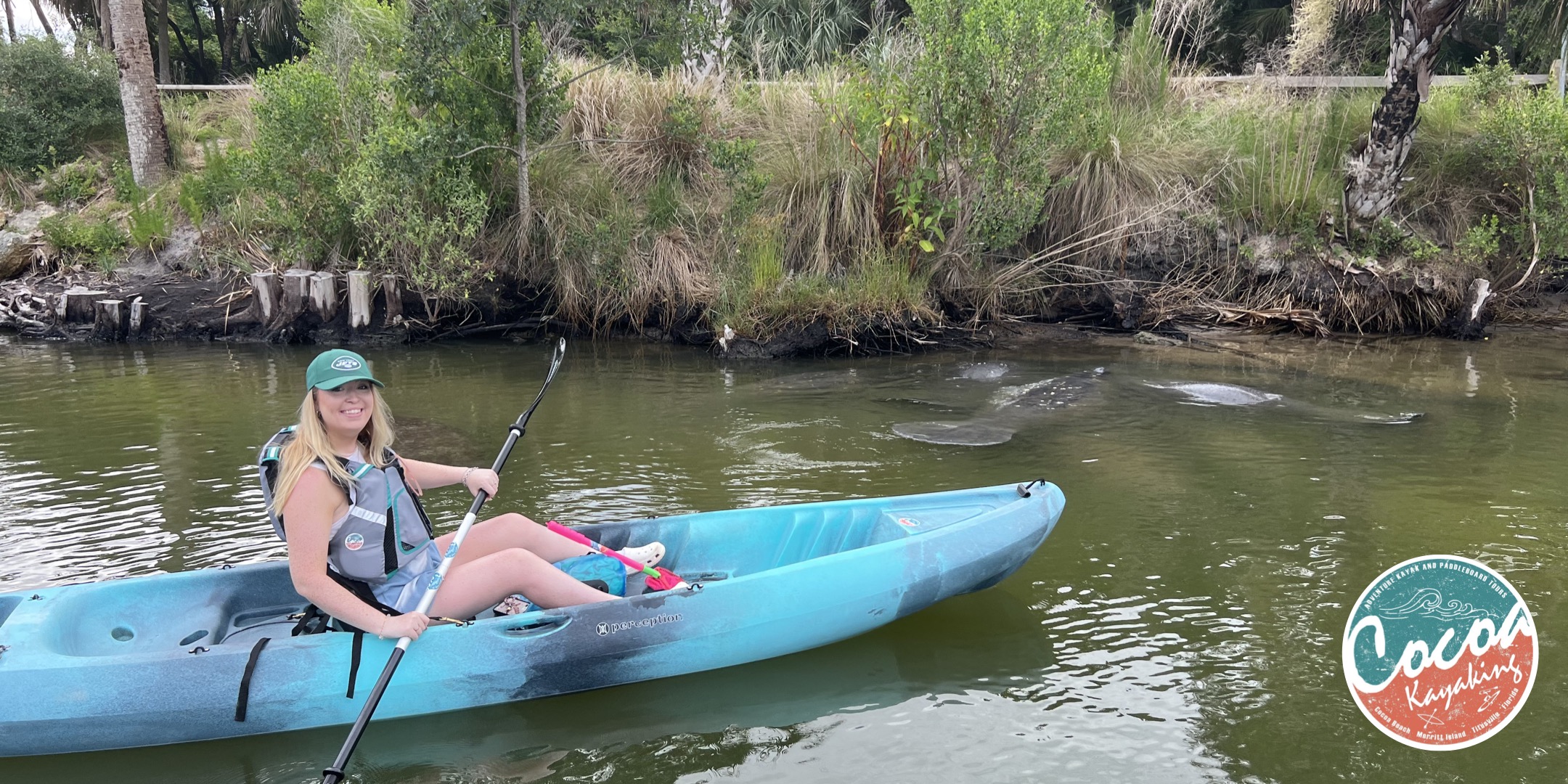 a person riding on the back of a boat in the water