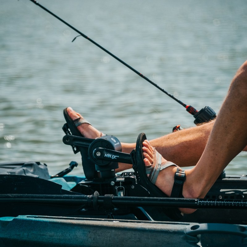 a man riding on the back of a boat
