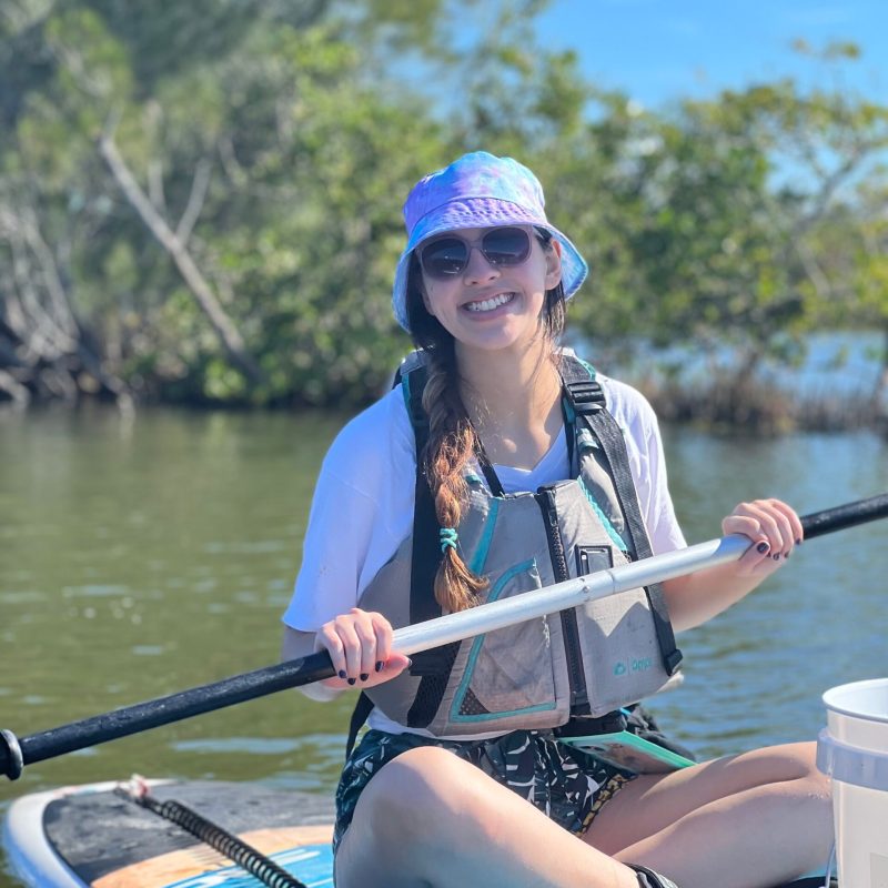 a person rowing a boat in the water